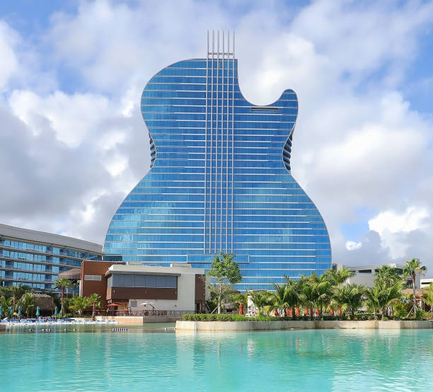 Guitar shape hotel in Florida Hollywood, Florida, USA - December 28, 2019:  Aerial view of the new Hard Rock Guitar Hotel and Casino with surrounding pool, built by the Seminole Indians. hollywood florida photos stock pictures, royalty-free photos & images