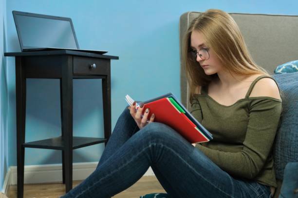 istock Girl is college student studying at home 1197480067