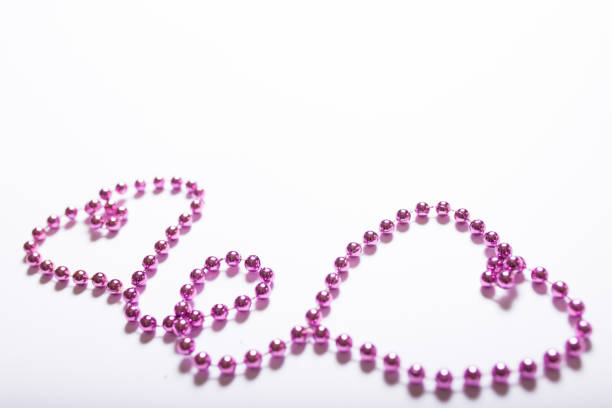 Hearts shaped purple necklace on a white background