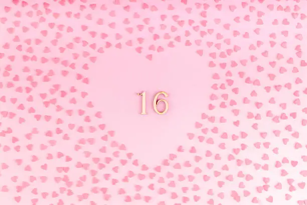 Photo of Number 16 Sixteen Made of Wood in Heart Shaped Decoration with Small Hearts