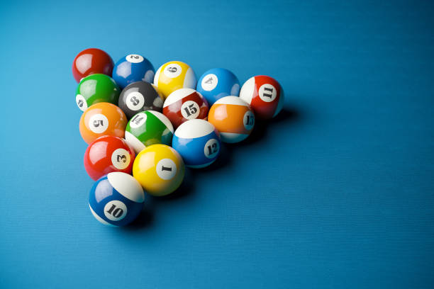 istock Snooker balls in billiard pyramid on billiard table. 1197486028