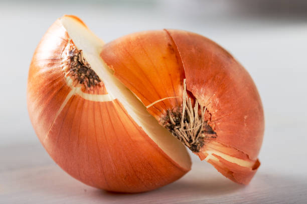 istock Onion, cut in half, isolated on white background 1197489318