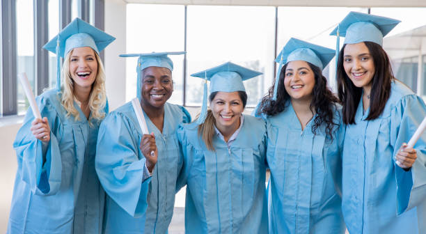 istock Diverse group of college graduates smiling together 1197489535