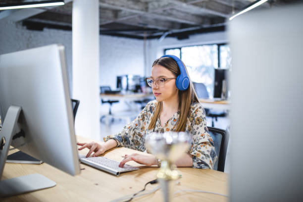istock Concentrated female IT expert working on web disign 1197490503