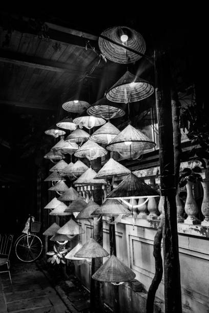 Traditional Vietnamese hat Non La lanterns lighting Cafe in Hoi An Vietnam.