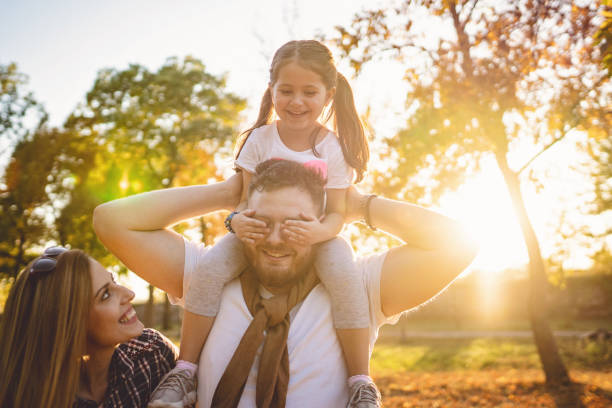 istock Playful daughter covering her daddy eyes 1197493633