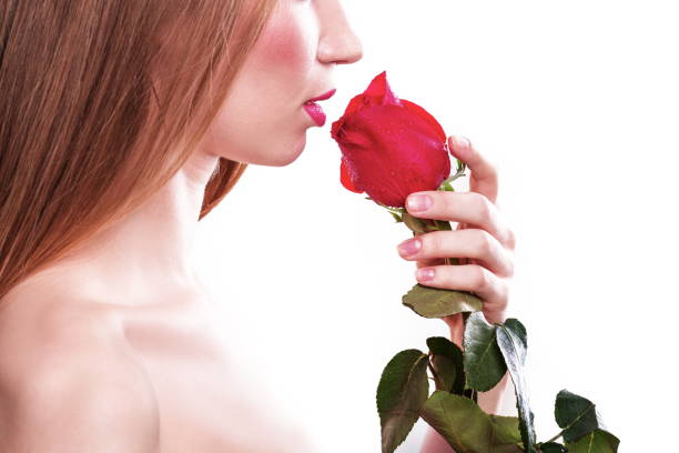 istock side view.a beautiful girl with a red rose. isolated on white 1197493877
