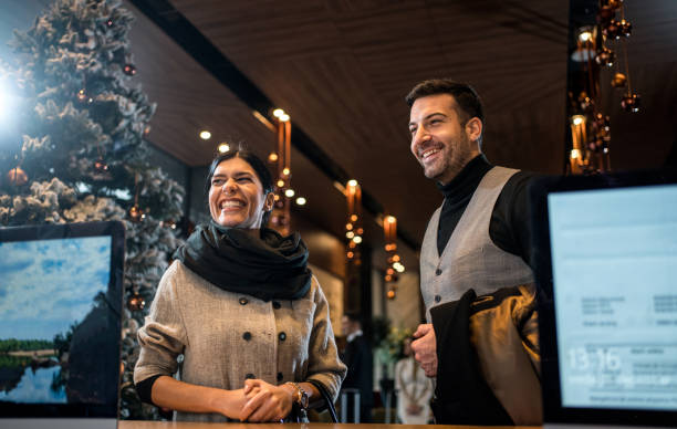 istock Cheerful couple at reception dask 1197493990