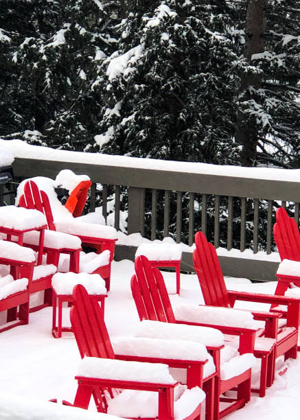 istock Snowy Red Adirondack chairs 1197494054