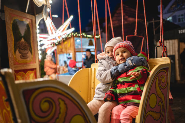Sisters on a carousel ride