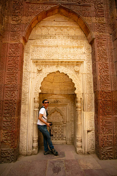 istock Young asian traveling in qutub minar 1197495145