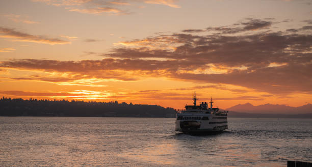Elliott Bay Elliott bay sunset with a Bainbridge Island ferry. elliott bay photos stock pictures, royalty-free photos & images