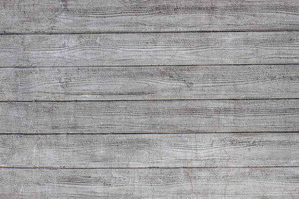 Gray concrete wall with traces of boards. Horizontal lines.