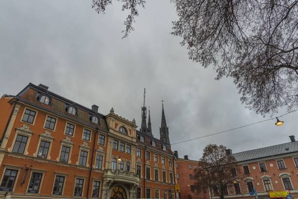 Sweden, Uppsala. 12.30.2019. Gorgeous view on town street with cathedral on background. Gorgeous  sky with thunderclouds on a winter day. Tourism / travel concept. Europe,