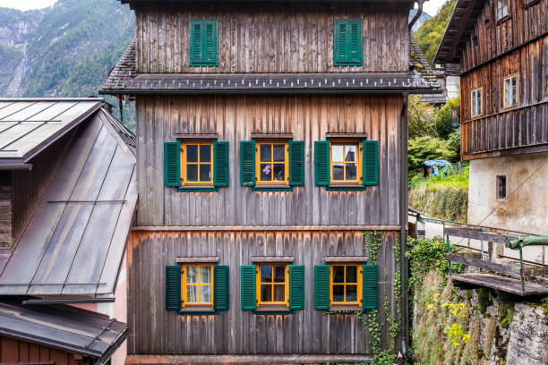 Windows at the famous Hallstatt mountain village in the Austrian Alps at beautiful light in autumn, Salzkammergut region, Hallstatt, Austria