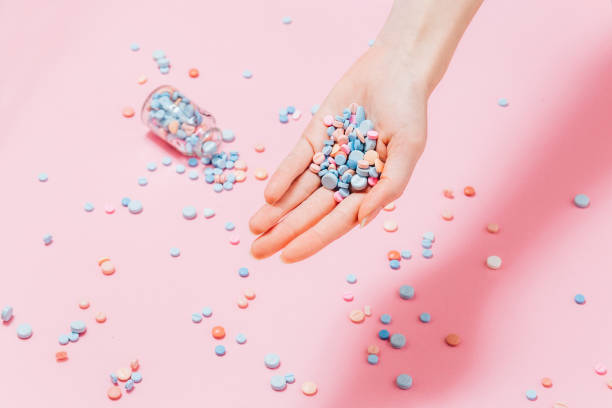 istock Hand full of pills 1197503540