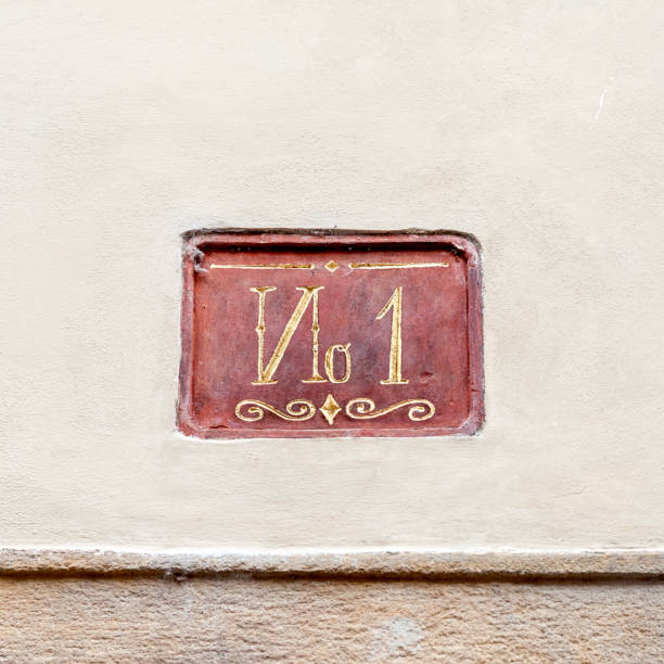 Decorative house number one lettering on concrete wall
