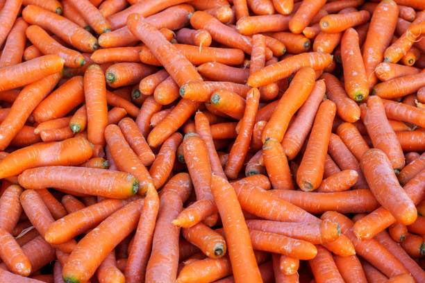 istock Pile of carrots close up. 1197506587