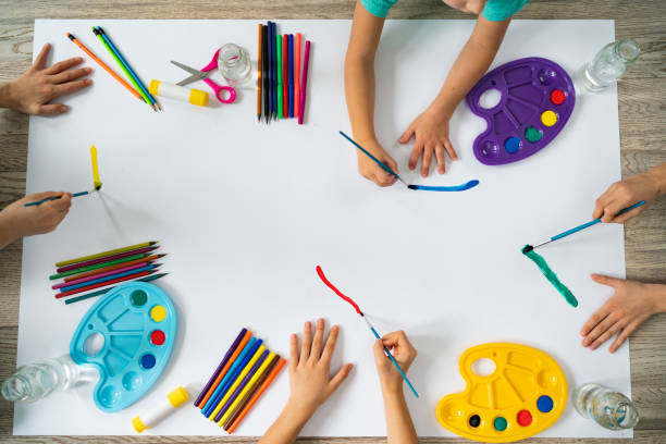 Creative Kids Childrens hands paint with painting tools crayon drawing photos stock pictures, royalty-free photos & images