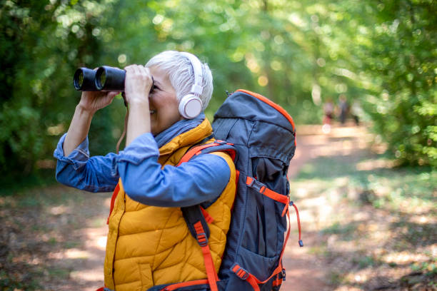 istock Happy senior women hiking in spring forest. 1197508308