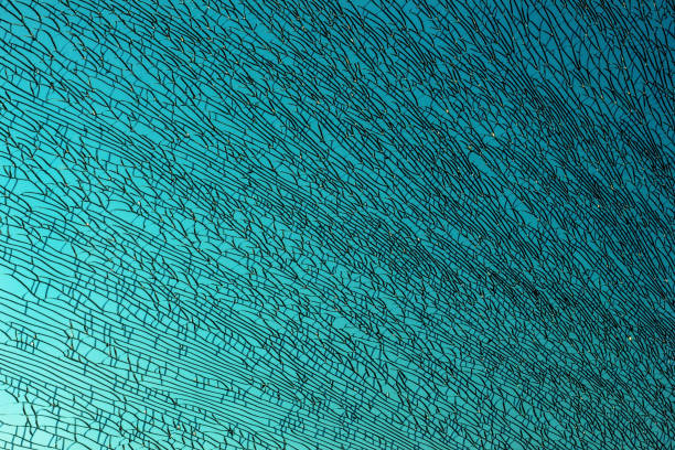 istock Broken glass on a blue sky background. 1197509380