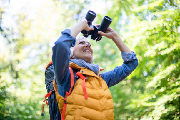 istock Happy senior women hiking in spring forest. 1197509603