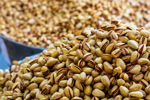 Photo of Heap of delicious fresh pistachios in the eastern bazaar.