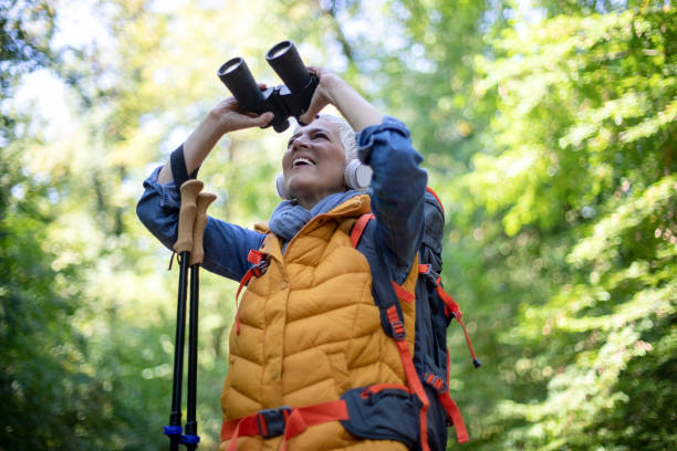 istock Happy senior women hiking in spring forest. 1197509897
