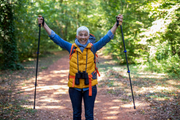 istock Active senior women hiking in spring forest. 1197510475