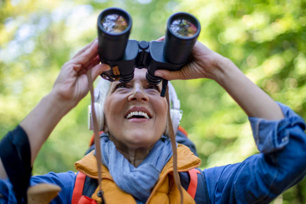 istock Happy senior women hiking in spring forest. 1197510520