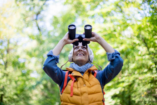 istock Happy senior women hiking in spring forest. 1197510541