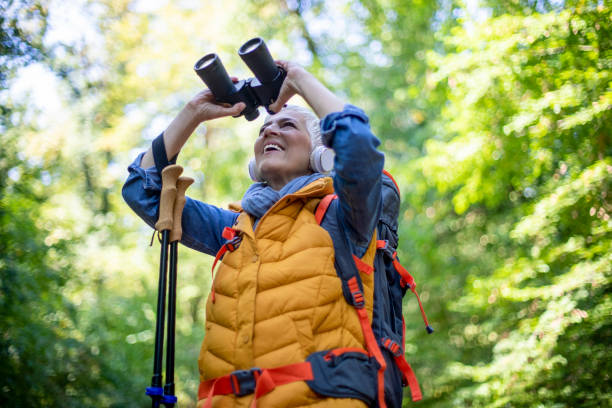 istock Happy senior women hiking in spring forest. 1197510658