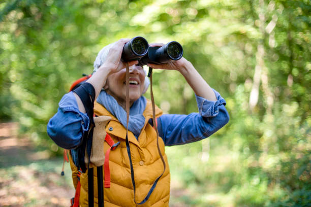 istock Happy senior women hiking in spring forest. 1197510661