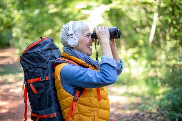 istock Happy senior women hiking in spring forest. 1197510670