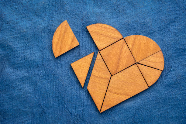 istock wooden heart tangram puzzle 1197512998