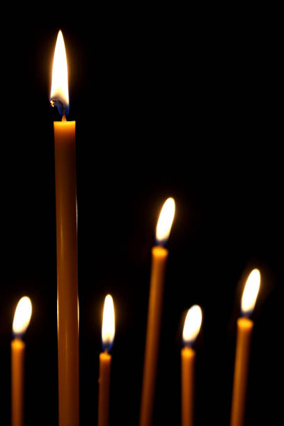 istock burning in the dark for four wax candles 1197514231