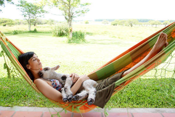 istock woman with lamb 1197515108