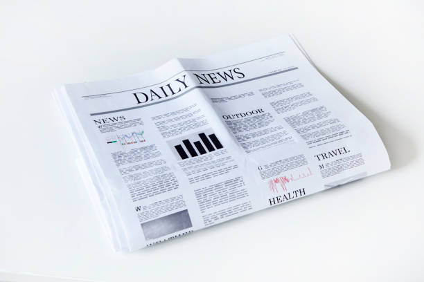 istock newspaper with news on white background 1197523756