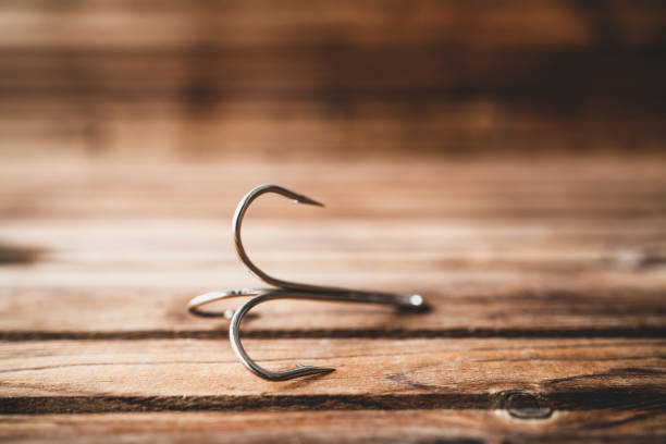 istock big size three hooks for fishing on wooden table 1197524849