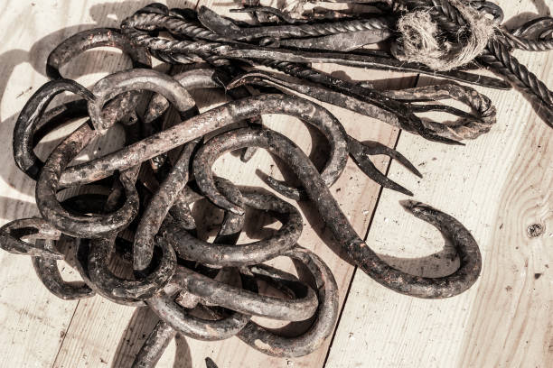 old and rusty hook two-sided pile of blacksmiths closeup