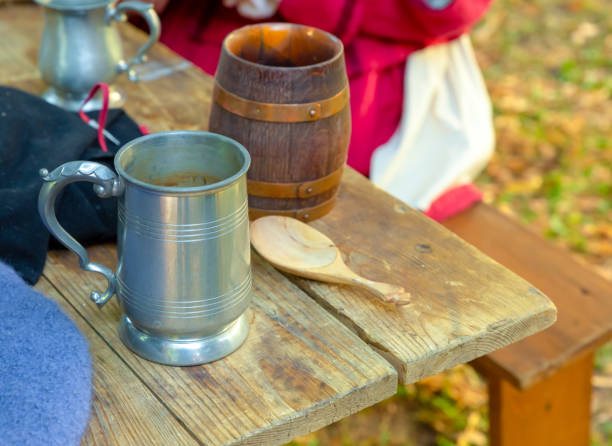 istock silver and ceramic tin mug on a wooden table picnic dinner tableware medieval pub 1197526402