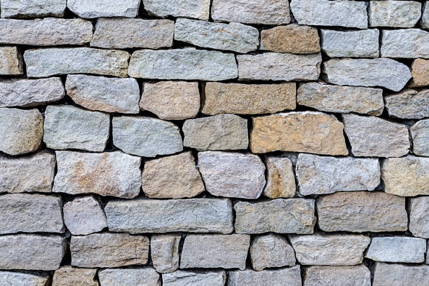 istock gray stone jagged and weathered old cobblestone background natural 1197527075