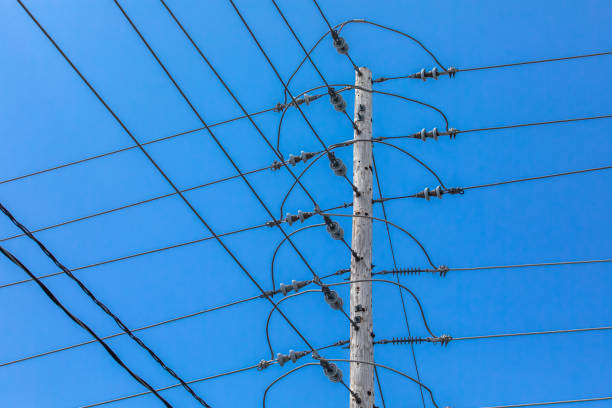 istock Electricity towers against a blue sky. 1197528762