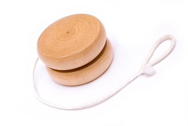 istock Wooden yo-yo toy with white string partially unwound 119752878
