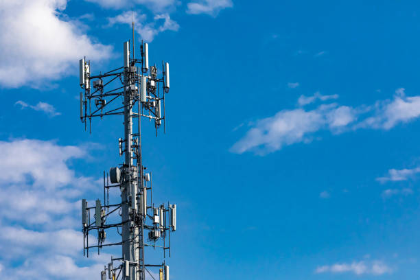 istock Cellular base station against blue sky. 1197528988