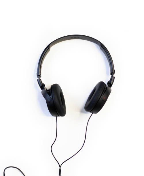 istock Classic black wired headphones on white background. Minimalistic music concept 1197529097