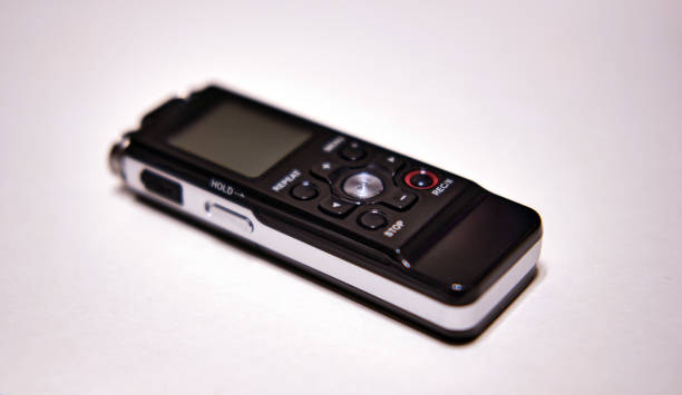 The speaker on a plain background. Sound recording equipment.