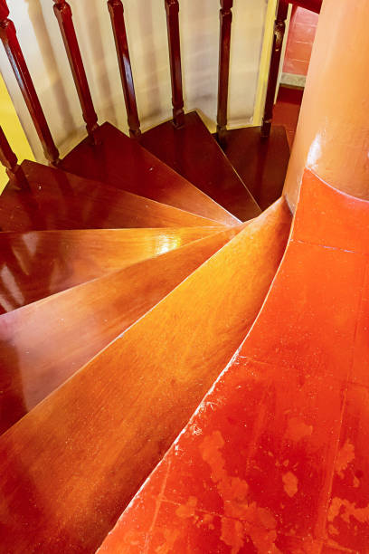 istock staircase wooden spiral steps natural material close-up railing going down 1197531266