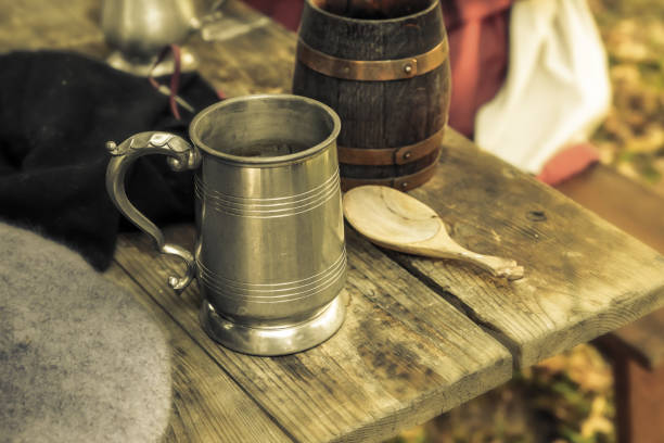 Beer mug tin ceramic traditional dishes pub. Middle ages close-up on the table