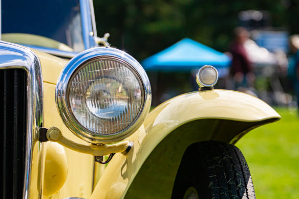istock Cream white classic antique car front 1197534325